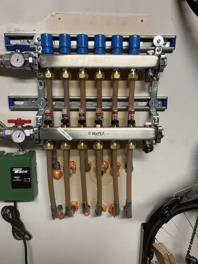 Plumber performing Water Heater Repair at a residential property in Laramie